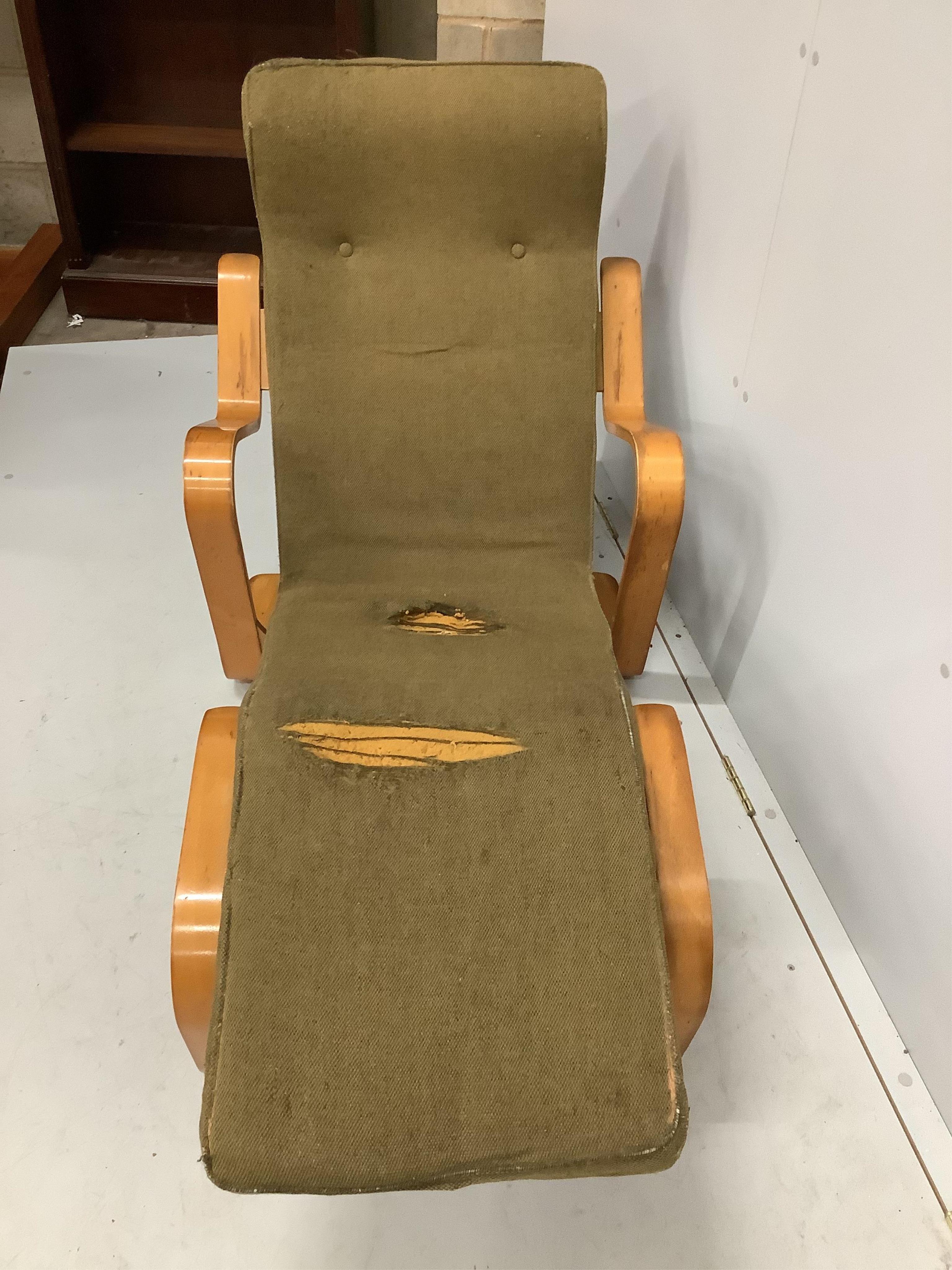 After Marcel Breuer, a bent ply long chair, circa 1960, width 134cm, depth 65cm, height 81cm. Condition - original upholstery now in need of replacement or removal, frame fair